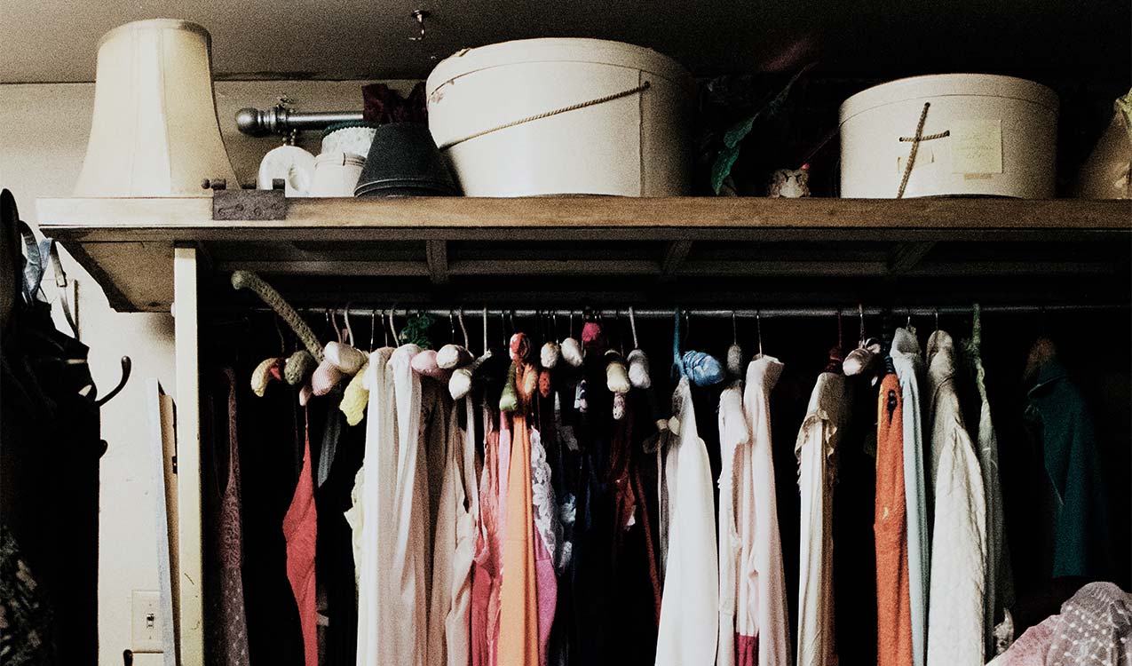 cluttered-nyc-apartment-closet-with-hats-boxes-hangers | Adept Organizer