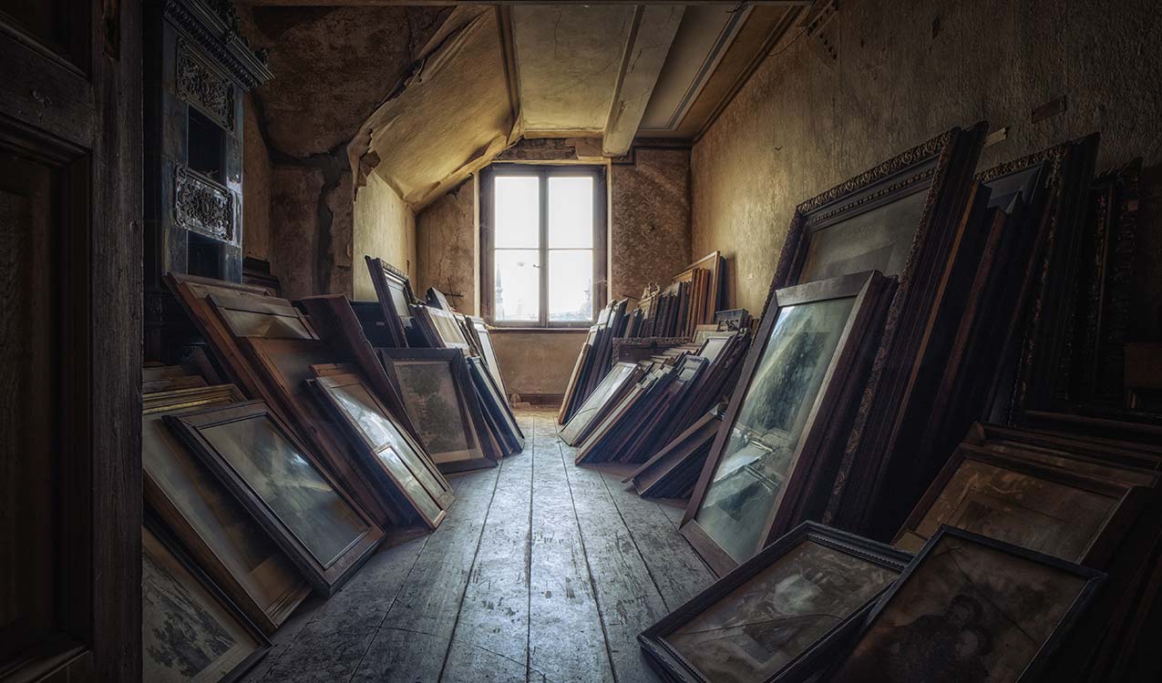 needed-declutter-for-age-worn-attic-with-several-old-paintings | Adept Organizer